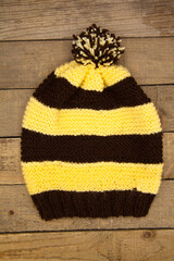 Handmade brown and yellow wool knitted winter hat