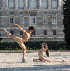 Elegant ballet dancers dancing ballet in the city