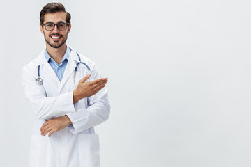 Man doctor in white coat and eyeglasses smile shows hand gestures signs on white isolated background looks into camera, copy space, space for text, health