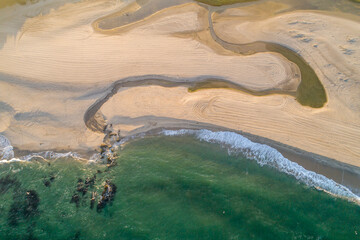 zenithal aerial drone view of the shore of a beach