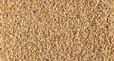 Dry bulgur pile background and texture, top view  