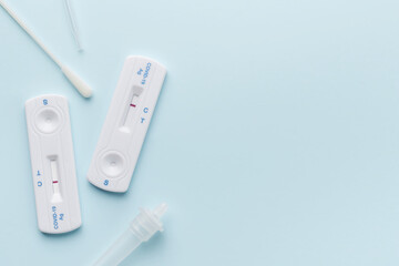 Home testing kit for coronavirus on a blue background