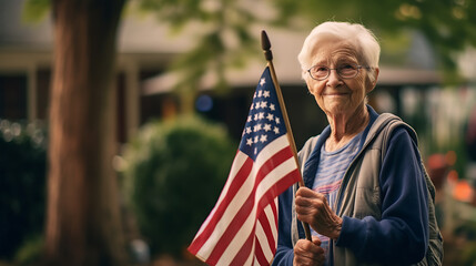 Naklejka premium Elderly female veteran holds up an American flag for the memorial day.Created with Generative AI technology.