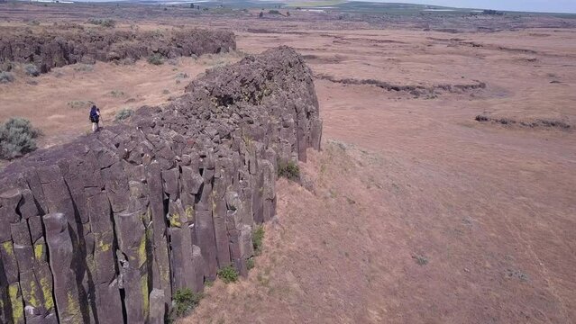 Hiker explores rugged terrain of rock columns in central Washington