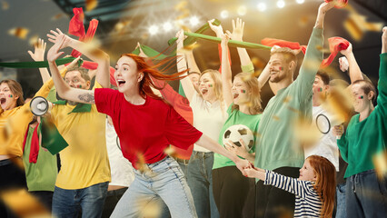 Young people, football fans and little girl, child watching live football match, cheering up...