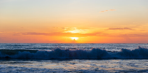 Natural scene of strong wave hit the beach with sunset sky, Phuket, Thailand.