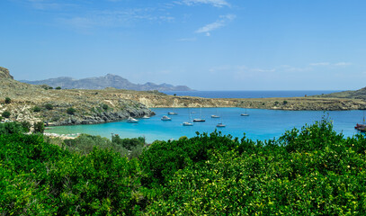 Panoramic view of the beautiful secluded bay and beach at Lindos town on the island of Rhodes, Greece