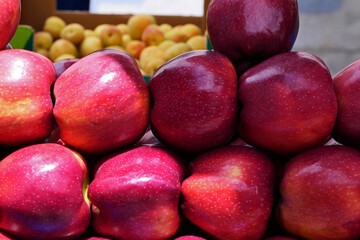organic and fresh red apples at the market stall
