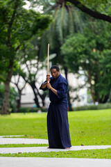 Handsome black martial artist man with martial arts costume of kendo