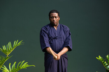 Handsome black martial artist man with martial arts costume of kendo
