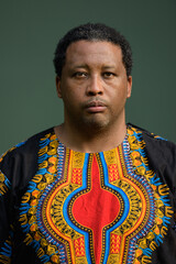 Portrait of handsome black man wearing traditional clothes