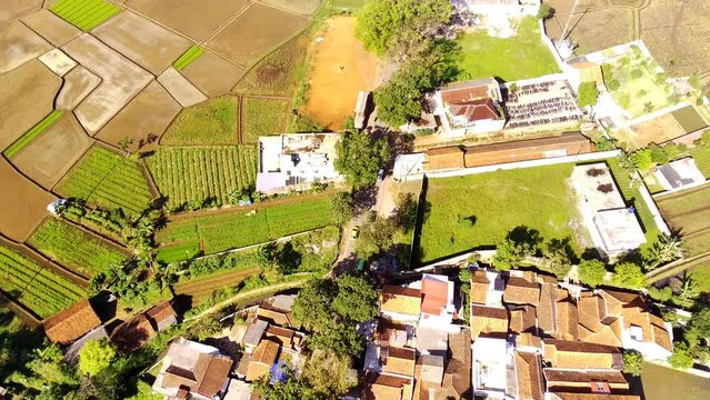 Industrial Footage. Aerial shot view of rice fields and highways. Located at Cicalengka Station, Bandung City - Indonesia