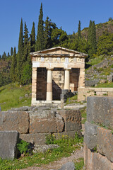 view to the Athenian treasury at the ancient oracle archaeological Delphi site, Greece