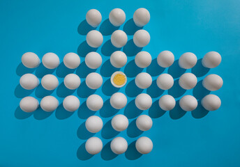 A large number of eggs on a blue background