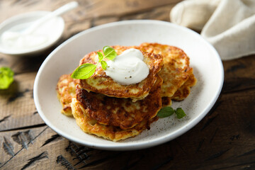 Traditional homemade latkes with sour cream