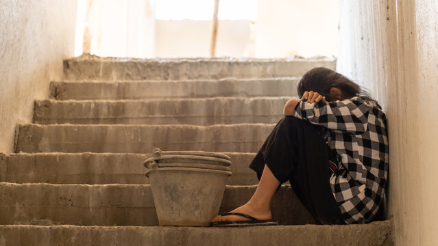 Children are forced to work in the construction area. Human rights concepts, stopping child abuse, violence, fear of child labor and human trafficking