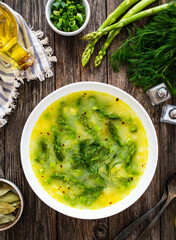 Asparagus soup on wooden table
