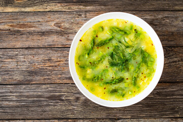 Asparagus soup on wooden table
