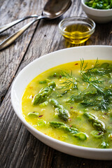 Asparagus soup on wooden table
