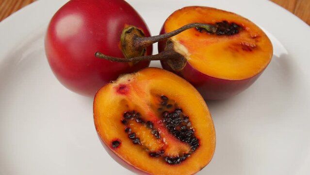 Cut tamarilla on a plate.