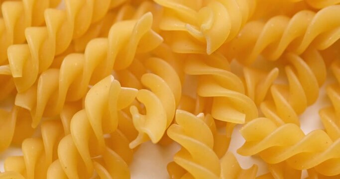 pasta backgroud - macro view of Dry Authentic Italian fusilli