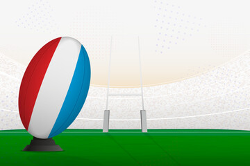 Luxembourg national team rugby ball on rugby stadium and goal posts, preparing for a penalty or free kick.