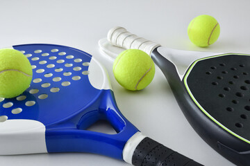 Background with two blue and black paddle rackets on white