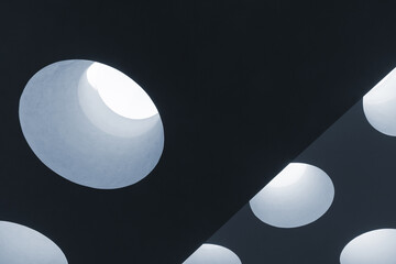 Ceiling structure with round skylight portals, abstract minimal photo