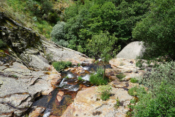 Rocks and river waterfall of clean water in the mountain
