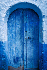 Vibrant blue door: A captivating splash of color, this door commands attention with its vibrant blue hue, evoking a sense of curiosity and wonder.