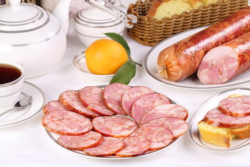 Still life with sausage on a wooden background