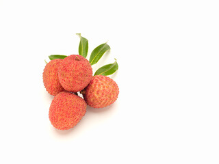 Fresh ripe lychees and green leaves on a white background.