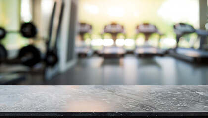 Empty black marble stone table top on blurred with bokeh Exercise room, fitness and gym interior background - can be used for display or montage your products