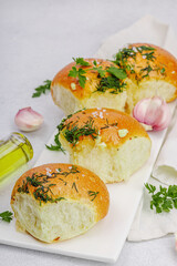 Aromatic garlic buns. Fresh baked goods, a traditional gluten-free soup snack. Parsley, spices