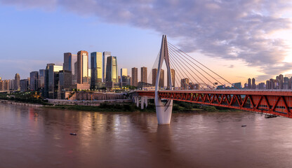 Obraz premium Panoramic view of city skyline and modern buildings in Chongqing at sunrise, China.