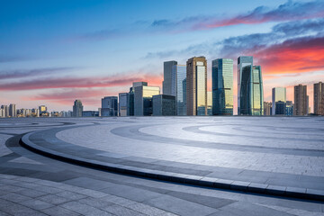 City square and skyline with modern architecture at sunrise