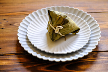 zong zi, bakcang in white ceramic plate
