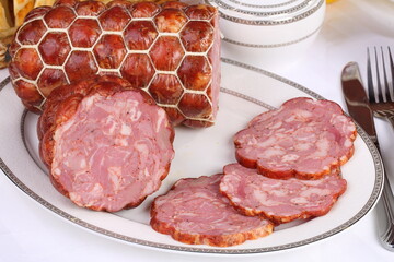 Still life with sausage on a wooden background
