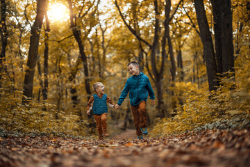 Fototapeta premium Cute little boy playing in nature