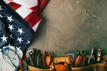Tools toolbelt and us flag on concrete cement background labor day banner mockup