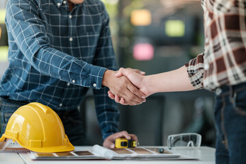 Two engineering man with construction worker greeting a foreman at renovating apartment.