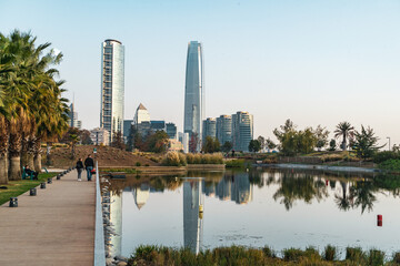 skyscrapers in the background of a park in santiago de chile