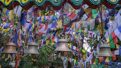 bells in the temple with the Tibetian prayer flag in the background, Mahakal temple, Darjeeling,...