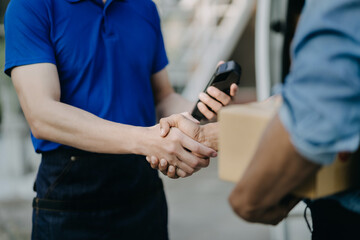 Businessmen shaking hands after successfully agreeing to start a new trade business.