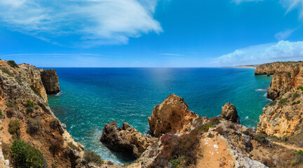 Fototapeta na wymiar Atlantic ocean summer rocky coastline view (Ponta da Piedade, Lagos, Algarve, Portugal).