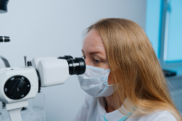 Fototapeta premium Portrait of a successful optometrist at work. Health care.