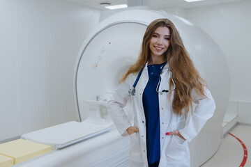 A successful young doctor in the X-ray laboratory. Professional CT scanner. Modern clinic.