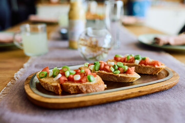 Bruschetta with tomato and vegetables.