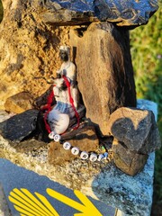 Way of Saint James marking with a religious figure and a ribbon reading 