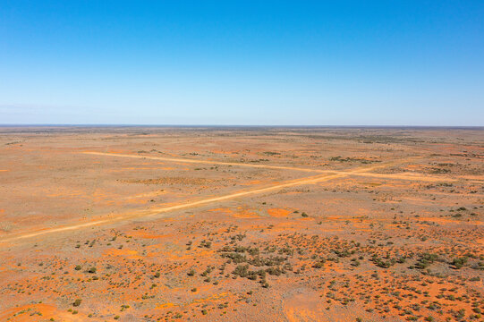 Intersecting runways of unsealed airstrip mark an x in the outback landscape at Kingoonya